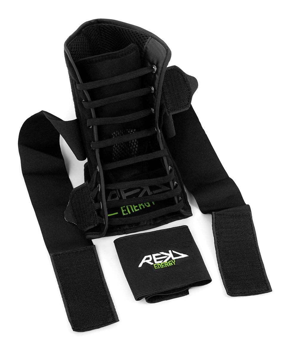 The REKD Energy Covert Ankle Skate Protection Braces in black come with adjustable straps and laces, featuring the "REKD Energy" text in green, and provide exceptional ankle protection.