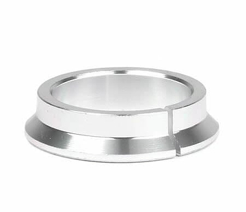 A Root Industries IHC Fork Headset Compression Ring, crafted from silver metal with a flat base and a distinct narrow cut on one side, is showcased beautifully against a plain white background.