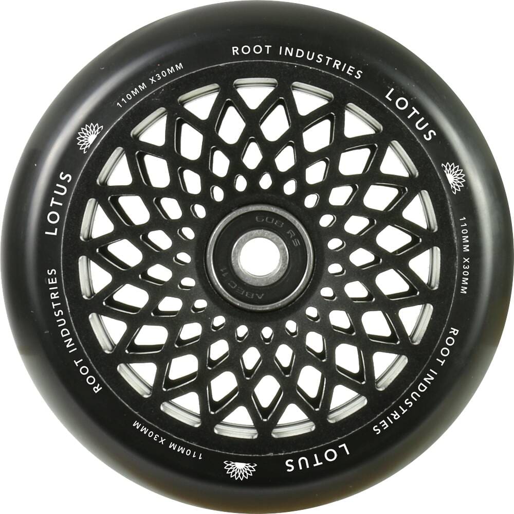 The Root Industries Lotus 110mm Scooter Wheel - Black boasts a sophisticated black color with a circular design, ideal for freestyle scootering. The innovative lotus core increases durability while adding an elegant touch to your ride.
