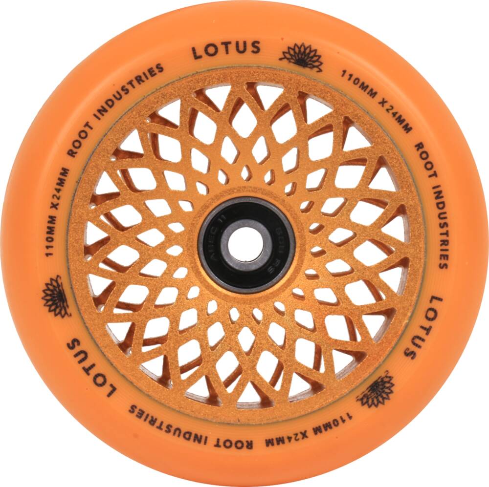 The Root Industries Lotus 110mm Scooter Wheel in Radiant Orange, ideal for freestyle scootering, features a striking lotus-like spoke design and a central black hub. This lotus core design merges aesthetics with functionality to deliver both style and performance.