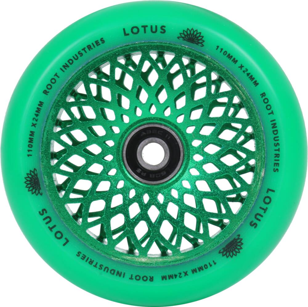 The Root Industries Lotus 110mm Scooter Wheel in Radiant Green features a floral-inspired cutout design, perfect for freestyle scootering. The outer rim is inscribed with "Root Industries" and "Lotus," as well as the dimensions "110mm x 24mm." Its high-quality urethane material surrounds a sleek black hub.