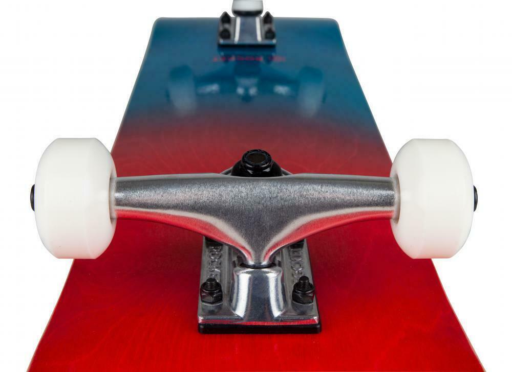 Side view of the Rocket Double Dipped Red / Blue Complete Skateboard - 7.5" x 31", highlighting its sturdy aluminium trucks and white wheels, set on a 7-ply hardrock maple deck with a blue to red gradient. The backdrop is a plain white.