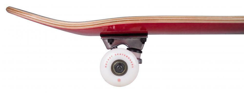 Close-up of the underside of a Rocket Double Dipped Red / Blue Complete Skateboard, crafted from 7-ply hardrock maple, showcasing one wheel and part of the wooden deck. The deck features a natural wood finish on top, while the white wheel displays subtle red text.
