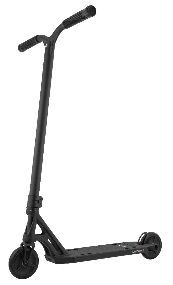 The Drone Shadow 3 Feather-Light Complete Stunt Scooter in black is a sleek ride that boasts a T-shaped handlebar, narrow deck, and Helios Hollow-Spoked Wheels. Its minimalist and modern design makes it an excellent choice for urban commuting.