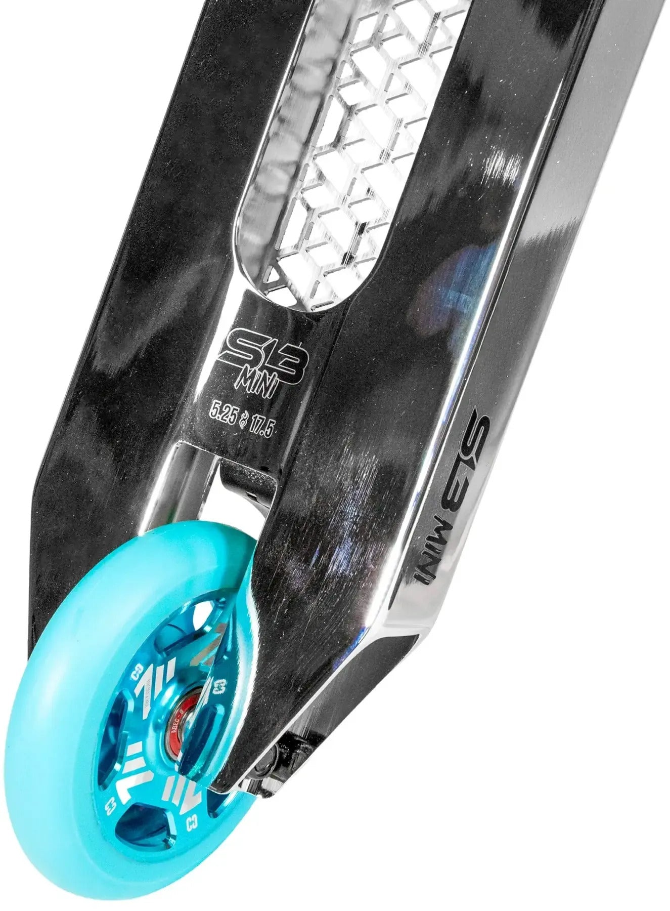 Close-up of the teal wheel on the CORE SL3 Mini Complete Stunt Scooter, attached to a chrome deck featuring hexagonal cutouts and engraved text reading “S8 MN 5.25 19.5” and “S3 MIN.”.