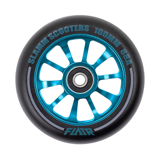 A close-up of the Slamm Flair 2.0 100mm stunt scooter wheel in blue, featuring a black tire with multiple spokes. It has "SLAMM SCOOTERS 100MM 88A" around the rim, "FLAIR" at the bottom, and is equipped with ABEC-9 bearings for smooth skatepark rides.