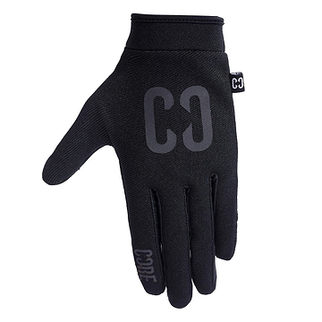 The CORE Aero Skate Protection Gloves in Stealth Black are sleek gloves that feature "CODE" on the index finger and "CØ" on the back. Made from smooth, fitted material, they boast a grip-enhancing design ideal for riding enthusiasts. They also include a small tag on the side and are touch screen friendly for convenient device use.
