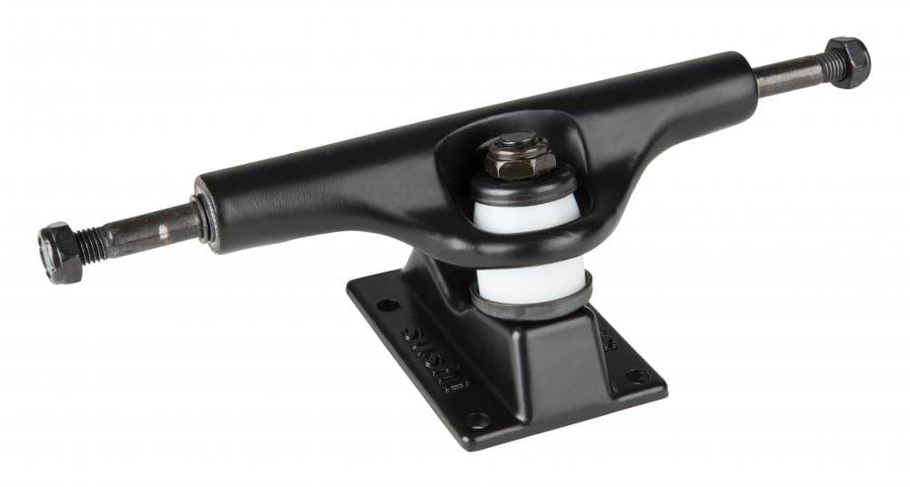 Close-up of a Sushi Pagoda Rasta skateboard truck in black, constructed from aluminum, showcasing the visible kingpin and bushings mounted on a baseplate. The high-tensile steel axles extend on both sides for wheel attachment. This 133mm truck is isolated against a white background.