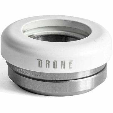 A close-up of a metal headset part labeled with "Drone," highlighting the sleek design of the Drone Synergy 2 Integrated Stunt Scooter Headset in white. The top section is white, while the bottom displays its metallic gray finish, designed specifically for scooter or bicycle assembly. It features super smooth bearings for an effortless ride.