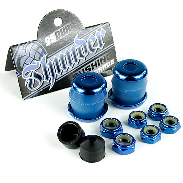 Detailed view of the Thunder Trucks Blue Bushing Rebuild Kit - 95A, featuring blue urethane bushings along with accompanying hardware like bolts and washers. The packaging in the background prominently displays "Thunder." This kit provides various components essential for assembling or maintaining a skateboard.