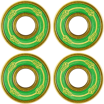 The UrbanArtt 8STD Scooter Bearings - 4 Pack, featuring green and gold accents with decorative text and concentric colored rings, are arranged in a square pattern on a white background. Designed by UrbanArtt for enhanced scooter speed, these bearings are suitable for an 8mm axle.
