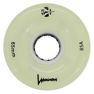 A cream-colored Luminous LED 85A Quad Roller Skate Wheel (White Glow, 65mm) has "65mm" and "85A durometer" printed on it, a central axle hole, the Luminous brand name, and black logos.