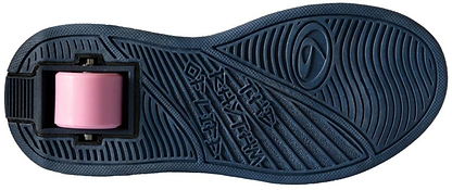 The image shows the bottom view of Breezy Rollers Blast Shoes - Purple by Breezy Rollers, featuring a dark blue sole with a single pink wheel in the heel. The patented wheel system and textured patterns offer both grip and smooth rolling.