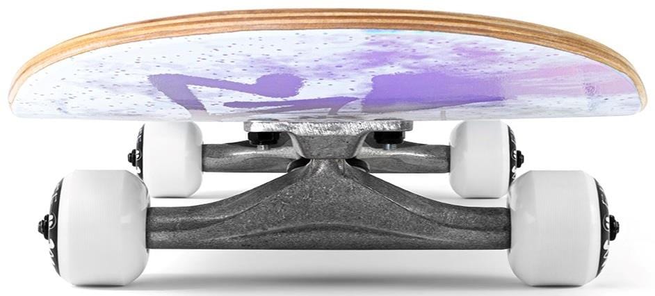 A close-up of the Enuff Skully Hologram White Mini Complete Skateboard - 7.25" x 29.5" shows high-quality components, including sturdy trucks and white wheels, all under a wooden deck with a vibrant purple and white graphic design.