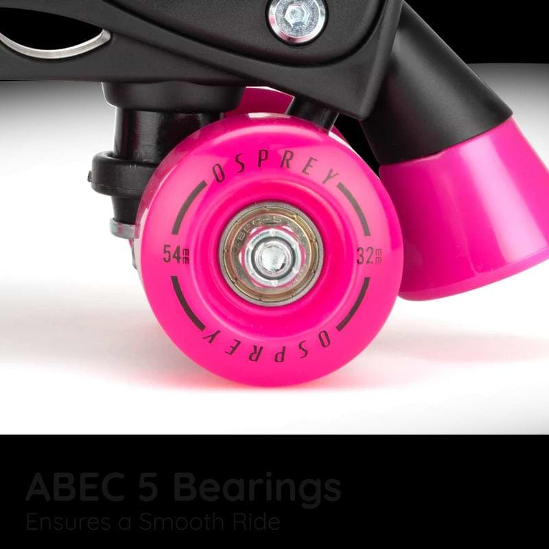Close-up of the Osprey Surge Semi-Soft Adjustable Quad Roller Skates in pink, featuring ABEC 5 bearings for a smooth ride. Designed by Osprey for kids, these skates offer comfort and are perfect for beginners.