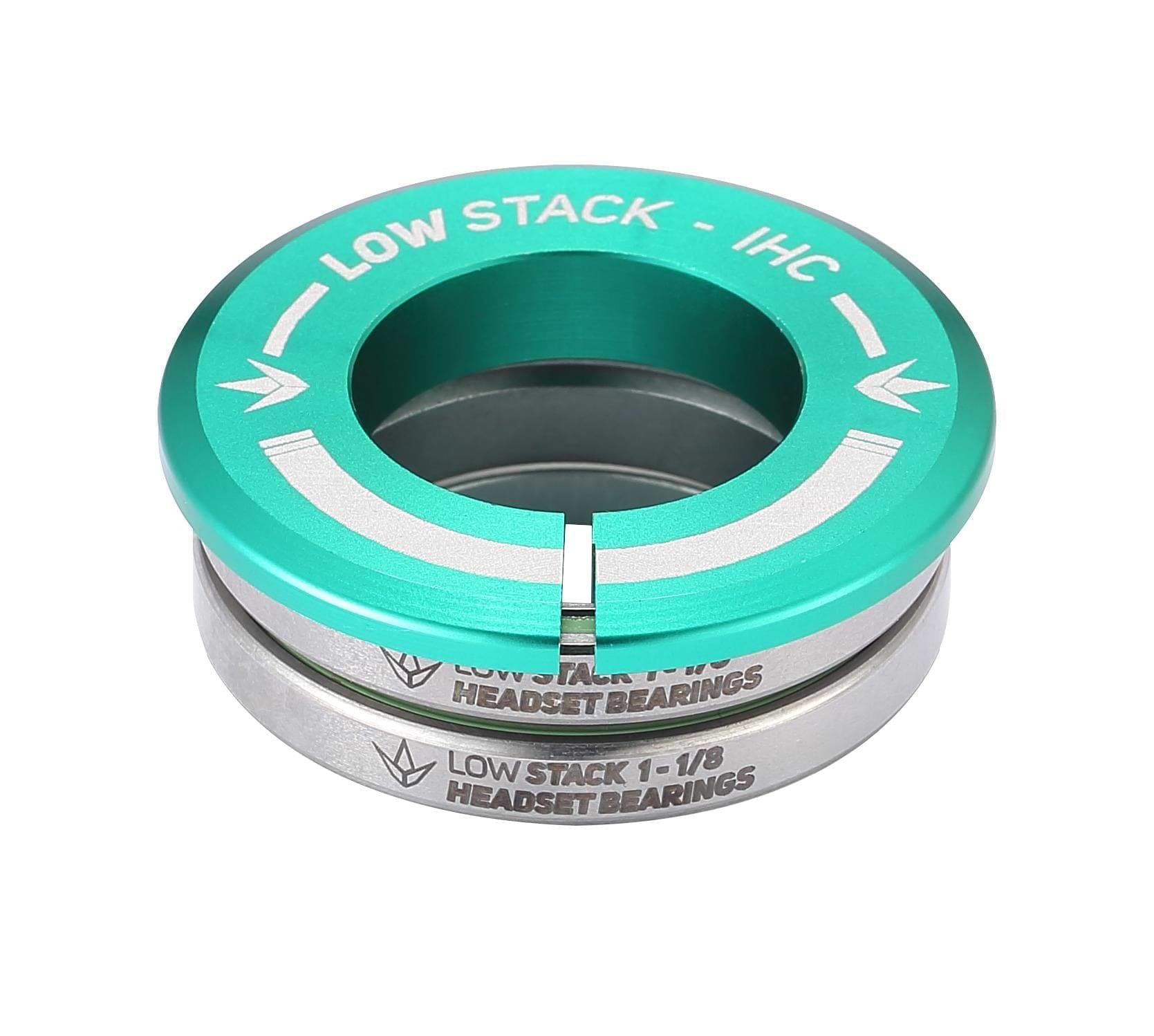 The Blunt Envy Low Stack IHC Integrated Stunt Scooter Headset in teal features sealed bearings and a distinctive arrow symbol. Its "LOW STACK - IHC" and "LOW STACK 1-1/8 HEADSET BEARINGS" labeling enhances its compatibility with the Blunt Envy Stunt Scooter, offering a sleek metallic finish through neatly stacked components.
