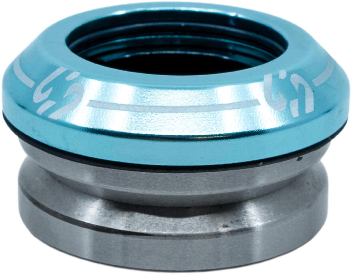 A close-up of the CORE Icon Integrated Stunt Scooter Headset - Blue by CORE, showing its blue anodized top cap and silver lower section—designed for smooth steering and compatibility with high-quality scooter bearings.
