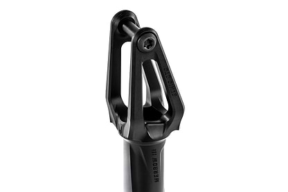 Close-up of the Ethic DTC Merrow V3 SCS Stunt Scooter Fork in black, forged from 7075 aluminium with three prongs and a central bolt, featuring "MERROW III" on the shaft and "CHROMAG" on the side—by Ethic.