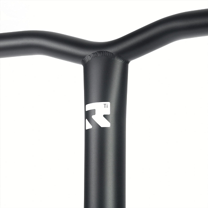 Close-up of a black scooter handlebar featuring a white logo with the letters "R" and "Ti." The Root Industries AIR Titanium Oversized HIC Stunt Scooter Bars have a smooth matte finish, showcasing visible welding marks at the joints.