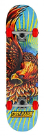The Tony Hawk 180 Series Golden Hawk Complete Skateboard (7.75" x 31.5") features bold eagle artwork on a blue deck, red wheels, and “Tony Hawk” in yellow. Built by Tony Hawk, it has a sturdy 7-ply maple deck and is great for entry-level skaters.