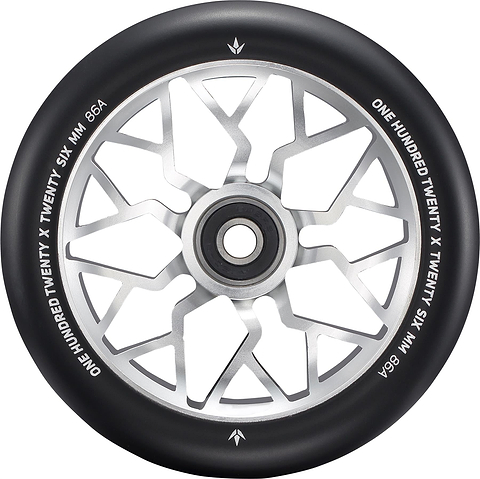 A close-up of the Blunt Envy Sector 120mm Stunt Scooter Wheel - Silver features a black and silver design with geometric spokes. The edge is marked with “ONE HUNDRED TWENTY X TWENTY SIX MM 86A.”.