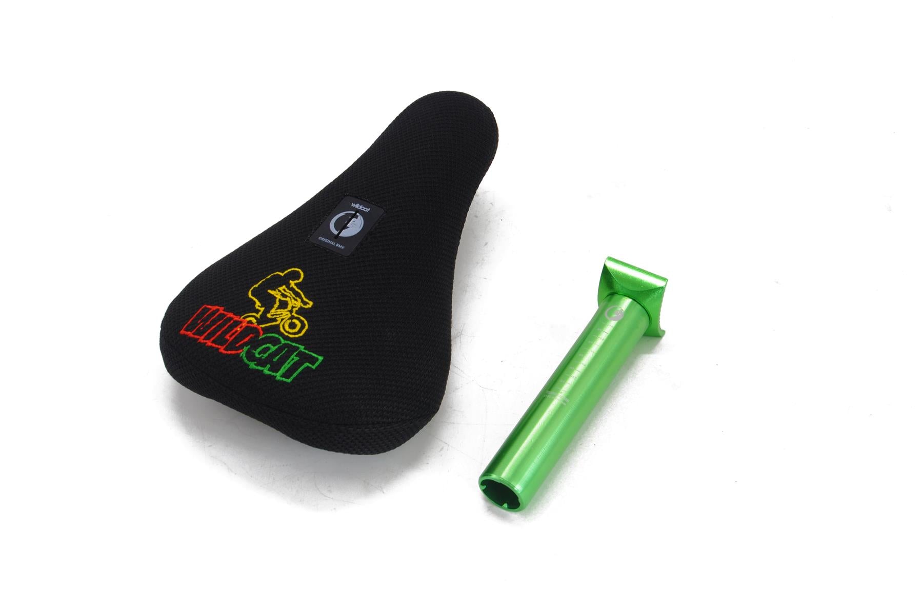 A black Wildcat bike seat features a colorful "Wildcat" logo and rider graphic, designed for the Wildcat OG Pro Mini BMX Bike - Joker Blue Neochrome, shown beside a metallic green seat post on a white background.