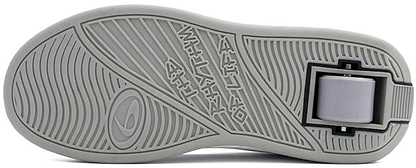 A close-up of the grey rubber sole of the Breezy Rollers Classic Shoes - White / Grey by Breezy Rollers, highlighting the patented retractable wheel system near the heel.
