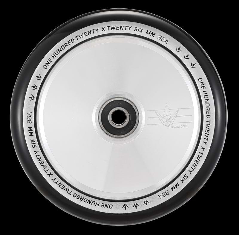 A close-up of the Blunt Envy 120mm Hollow Core Stunt Scooter Wheel in Silver Chrome highlights its metallic silver core and black tire, designed for maximum performance. The rim is adorned with the inscription "One Hundred Twenty x Twenty Six mm 86A" and features a bird logo along with "Hollow Core," showcasing Blunt Envy's advanced Hollowcore Wheels technology.