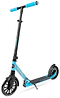 The Madd Gear Metro Cruise 250 Foldable Commuter Scooter in Black/Blue features large wheels, a textured foot deck, adjustable handlebar, and kickstand. The Madd Gear (MGP) scooter is shown at a slight angle on a white background.