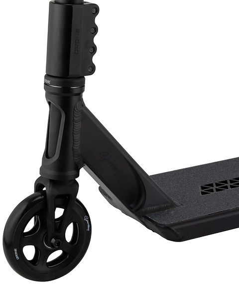 Close-up of the Drone Nexus Kai Saunders 'Saundezy' Signature Stunt Scooter front, highlighting the wheel, fork, clamp, and grippy deck surface.