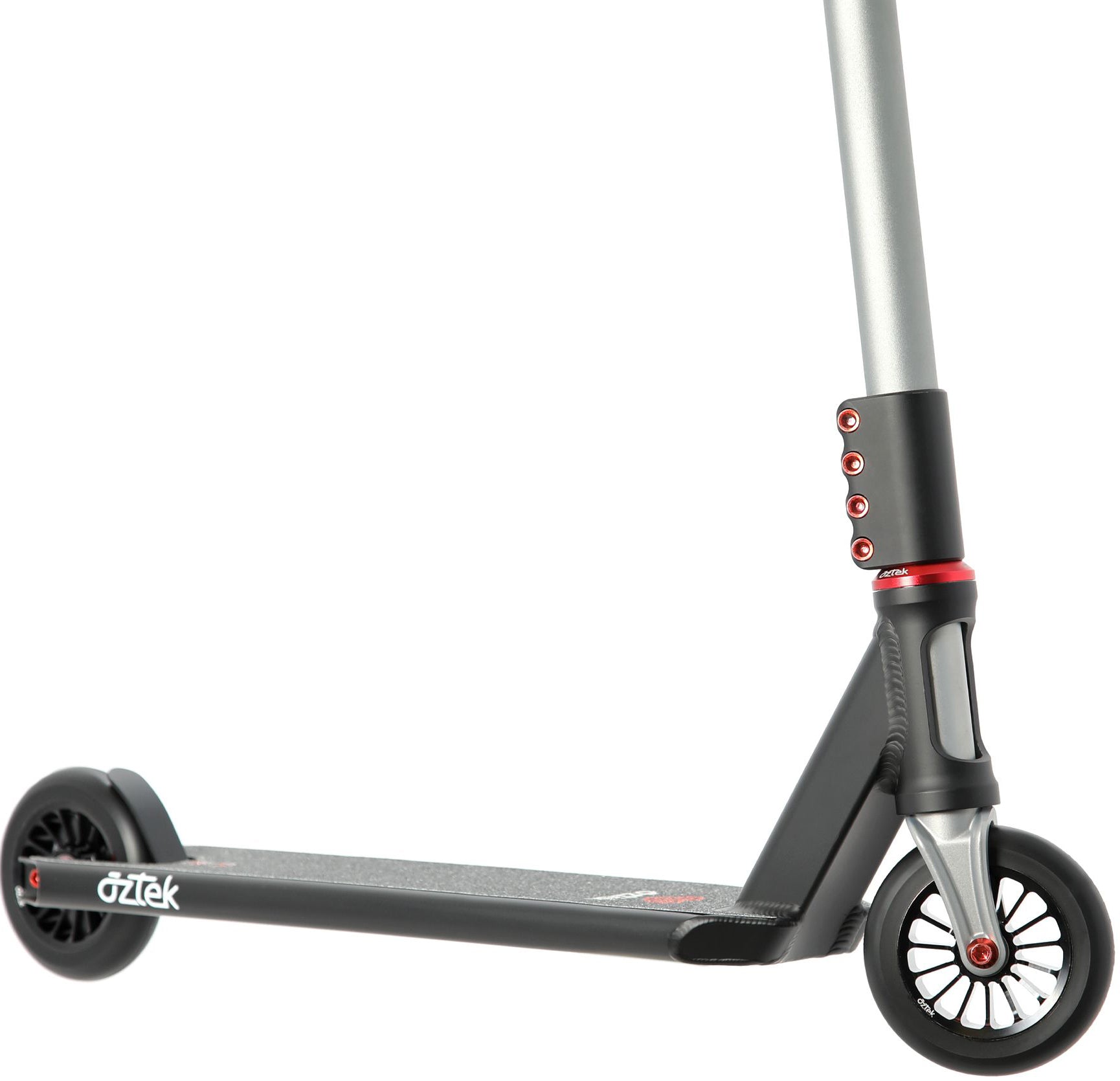 A close-up of the Aztek Corsa 2026 Complete Stunt Scooter in Satin Black captures the deck, front and rear wheels, and a portion of the handlebar. This lightweight stunt scooter showcases red accents, with the Aztek branding clearly visible on the deck—emphasizing its quality craftsmanship.