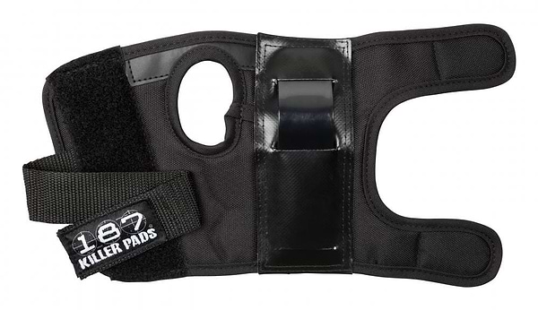 The 187 Killer Wrist Guards Skate Protection - Black offers durable wrist support with a thumb hole and adjustable Velcro straps for maximum protection. The straps feature the "187" logo, underscoring its high quality. Crafted from robust materials with reinforced plastic, these guards deliver enhanced security.