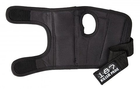 The 187 Killer Wrist Guards Skate Protection in black features a thumb hole and adjustable strap closure. Designed to provide superior wrist protection, it includes supportive padding and proudly displays the "187" brand label on the strap.
