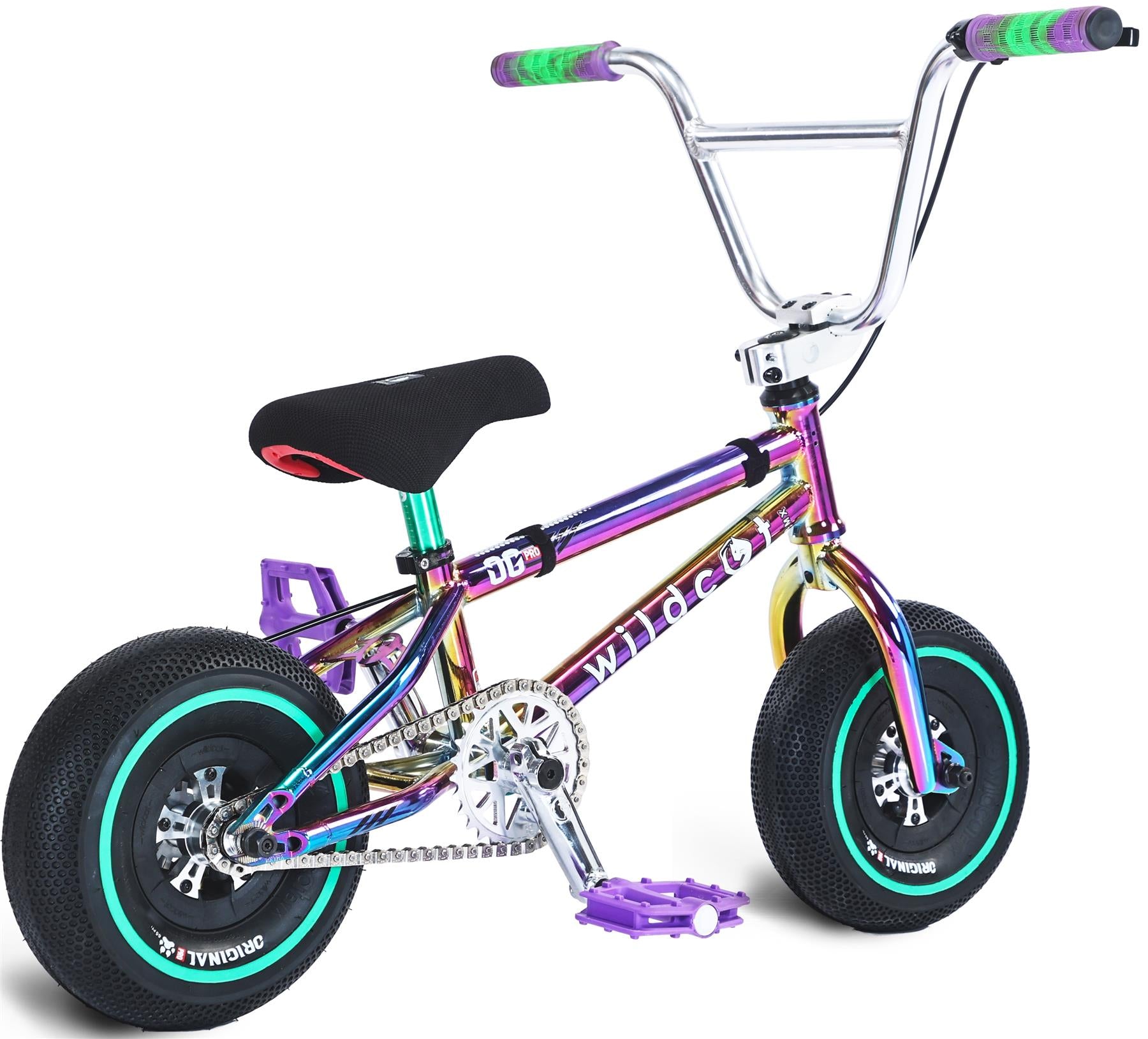 The Wildcat OG Pro Mini BMX Bike - Joker Green Neochrome is a small, colorful BMX with a shiny iridescent frame, black seat, thick black tires with teal rims, purple pedals, green-and-purple handlebar grips, and "wildcat" on the frame.