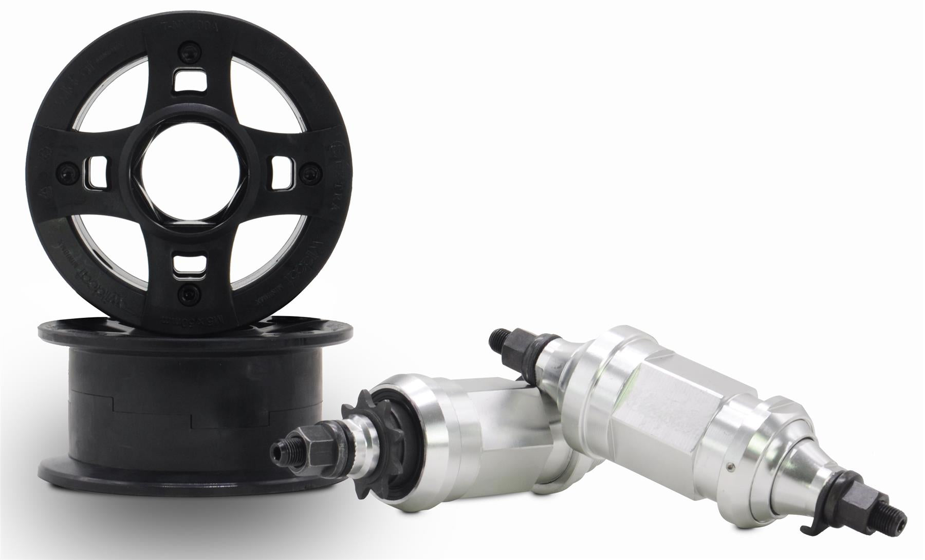Two black plastic pulley wheels—one upright, one flat—are next to two silver parts with black threaded ends, all essential for the Wildcat OG 3A Mini BMX Bike - Galaxy Blue by Wildcat, showcased on a plain white background.