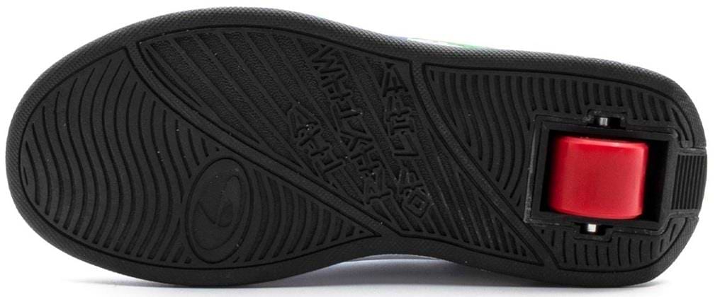 The image features the bottom of a Breezy Rollers Splash Shoe (White/Black/Multicoloured) by Breezy Rollers, displaying its textured tread and signature single red wheel in the heel, which highlights its patented wheel system.