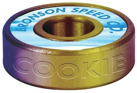This skateboard bearing display features a gradient with "BRONSON SPEED CO." at the center, surrounded by a blue and white pattern. The side reads "COOKIE," honoring pro skater Chris Cookie Colbourn with G3 Skateboard Bearings from Bronson.