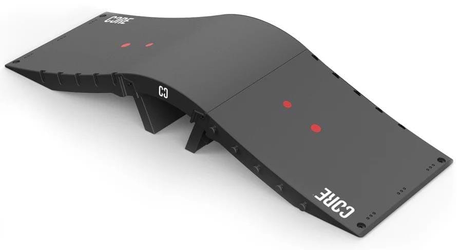 The CORE Mini Wave Skate Ramp Set - 2 Kickers & Bridge by CORE is a black, wave-shaped ramp for skaters, scooter riders, and inline skaters, featuring red dots on each flat and "CORE" in white at each end.
