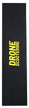 The Drone 'Scootering' Logo Stunt Scooter Griptape, by Drone, in black with rough texture and bold yellow "DRONE SCOOTERING" text at the center, is designed for stunt riders seeking exceptional control.