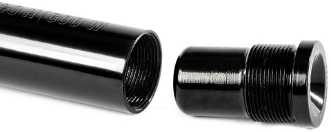 A close-up view of the Ethic DTC Handlebar Balance Point Modulation - 150g shows a black metal pipe with internal threads alongside a coordinating threaded cap, both precisely aligned for assembly—perfect as a scooter bar end to fine-tune balance points, crafted to Ethic’s renowned quality standards.