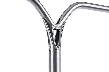 Close-up of the Ethic DTC Deildegast V2 Steel Oversized HIC Stunt Scooter Bar in raw silver (720mm x 600mm), showing a welded joint with a triangular cutout, crafted from durable 4130 Chromoly Steel and branded with "Ethic" near the top.