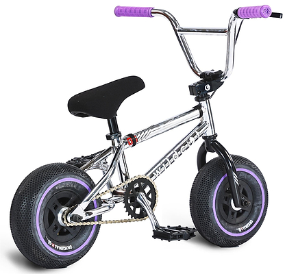 The Wildcat OG 3A Mini BMX Bike - Galaxy Purple is a small chrome bike with thick black PRO Street 65PSI tyres, purple CNC aluminium wheel rims and treads, purple grips and pedals, a black seat, and "wildcat" on the frame.