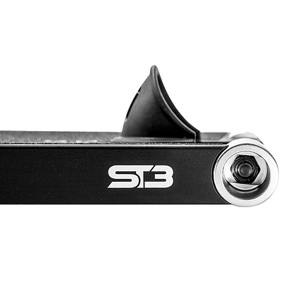Close-up of the CORE ST3 Forged Black Street Stunt Scooter Deck (6.5" x 22.5") by CORE, showing a visible bolt and a plastic or rubber piece above it, with "ST3" in white lettering on the wide deck against a white background.
