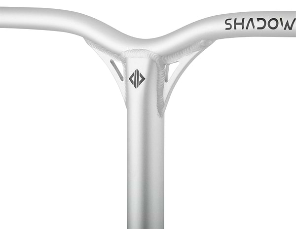 Close-up of a bicycle handlebar with a sleek, metallic finish akin to the Drone Shadow 2 Aluminium IHC Stunt Scooter Bars. The Y-bar design showcases a central beam, reinforced joints, and minimal branding at the top right and center.