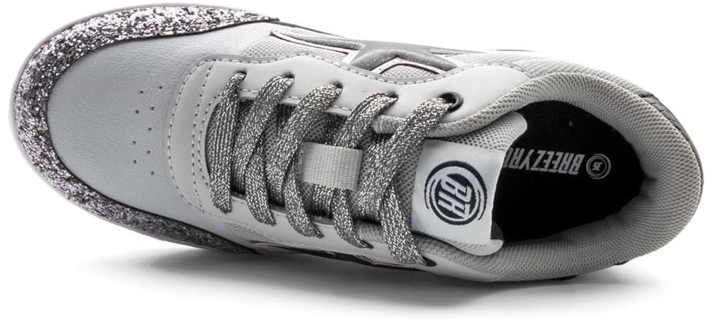 The Breezy Rollers Star Shoes - Silver / Grey feature a glittery heel and laces, black interior with white text, a round logo on the tongue, and Breezy Rollers’ patented wheel system for easy rolling—shown here in a top view.