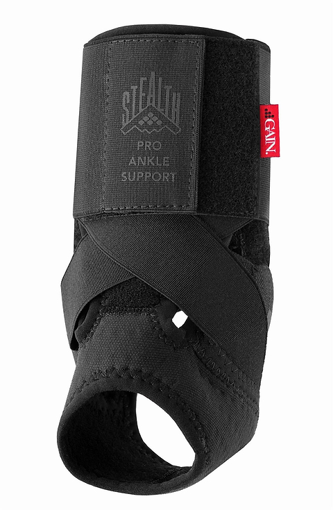 The GAIN Protection Stealth Pro Adult Ankle Support - Black features crisscrossed elastic straps, a large velcro closure, and impact protection to stabilize and protect your ankle.