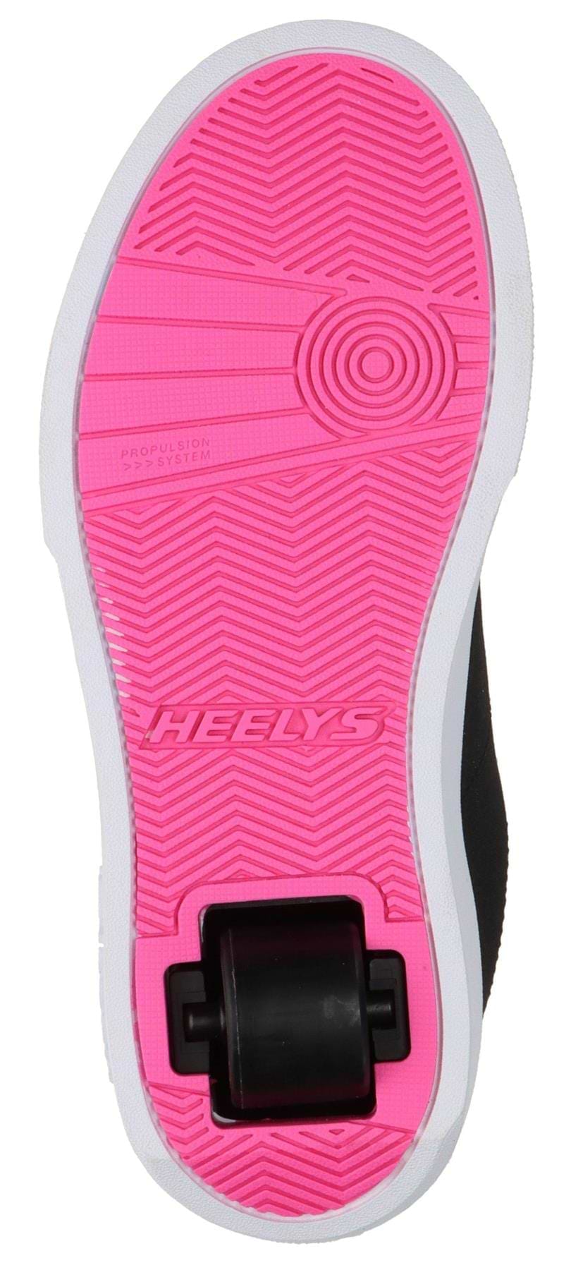 The image shows the bottom of Heelys Digilo Nylon Girls Shoes in Black/Pink, featuring a bright pink sole with "HEELY'S" embossed at the center and low-profile wheels near the heel.