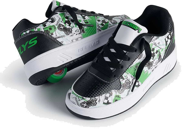 The Heelys x Minecraft Kama Boys Shoes in white, black, and green feature bold graphic patterns and a visible green wheel in the sole, blending Heelys' roller design with gamer-inspired Minecraft style.