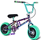 The Wildcat OG Pro Mini BMX Bike - Joker Green Hulk by Wildcat features a metallic frame, black seat, green handlebars, and bright green chunky tires with a Turbo wheel design and “wildcat” on the frame—colorful, compact, and built for action.