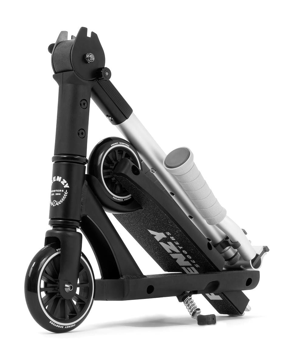 The Frenzy Flex 120mm Recreational Scooter in black and silver is shown folded for compact storage. Its wheels are visible, the handlebars rest along the deck, and the "Frenzy" brand is displayed.